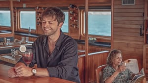 Man drinking a cocktail in Coral II