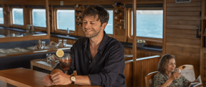 Man drinking a cocktail in Coral II