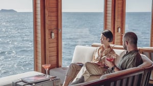 Couple relaxing at the Charles Darwin Lounge and bar in the Galapagos Legend