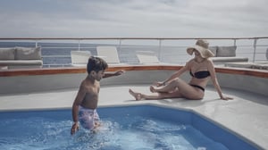 Family in the swimming pool ondoard