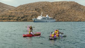 Go Galapagos expedition cruise ship sailing in the crystal-clear waters of the Galapagos Islands