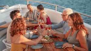 Guests enjoying sunset drinks on deck during a Galapagos cruise