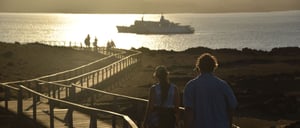 Bartalome - Bartolome Visitor Sites: Traveleres watching at dusk