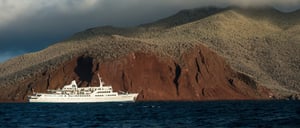 Rabida in Galapagos Islands, view of the red sand with Galapagos Legend