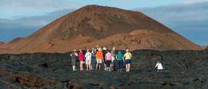Sullivan bay, solid volcanic lava with tourist watching all