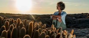Girl enjoying the sunset in the Galápagos Islands