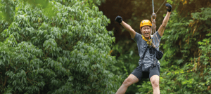 Ecuador Land Tours -  A person doing canopy in one of our expeditions