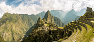 Machu Picchu, Peru’s iconic Inca site, featured in a Galapagos and Peru travel package with Ecuadorian highlights.